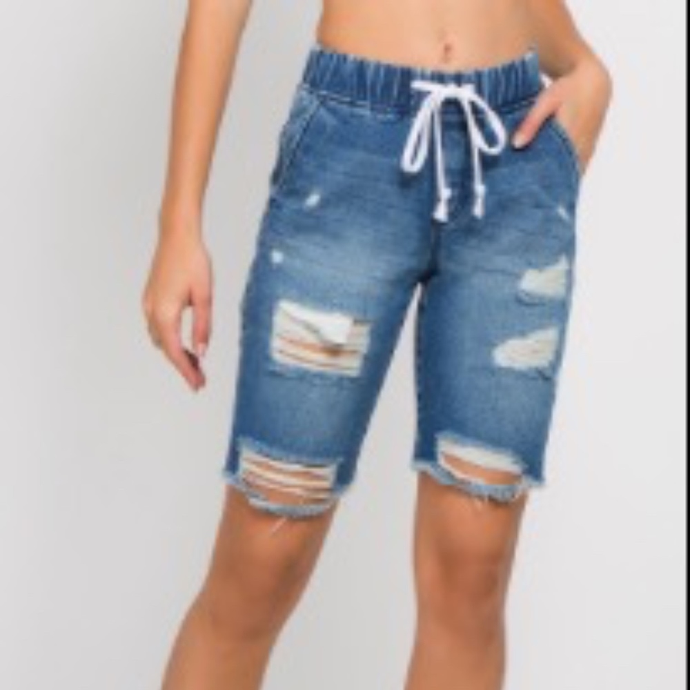 Distressed denim shorts.